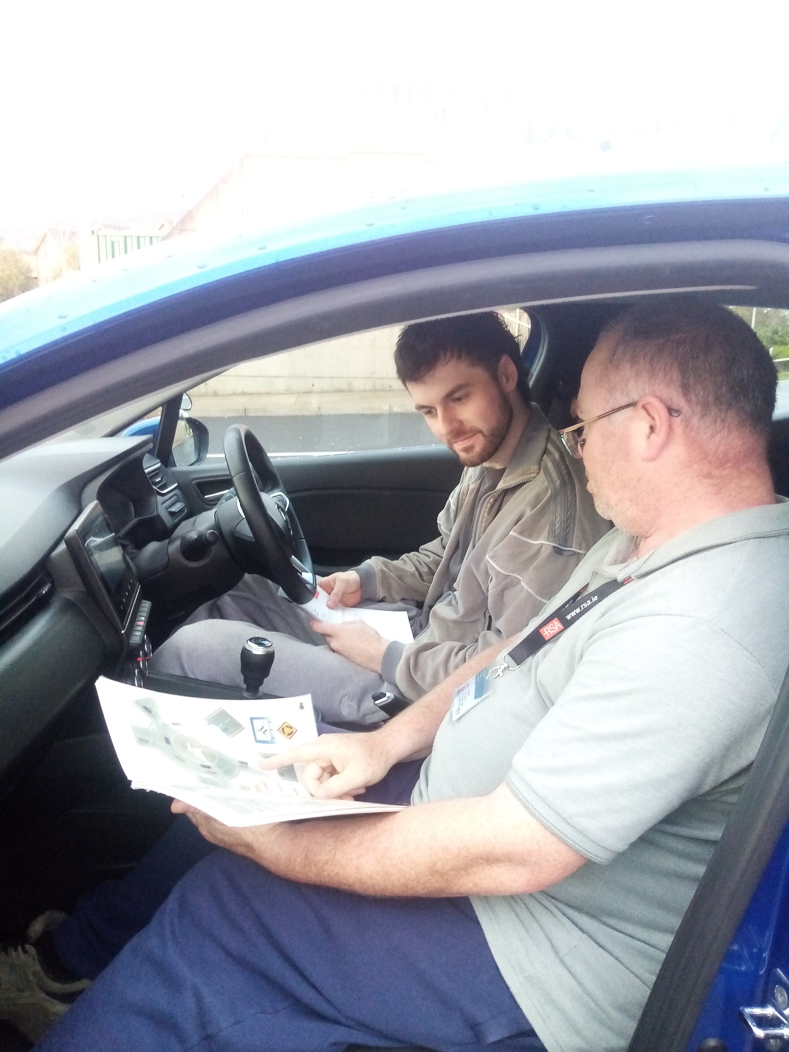 Instructor with student in car